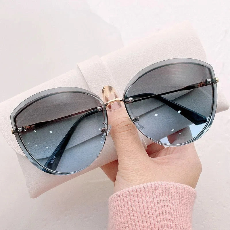 High Quality Women's Oval Rimless Sunglasses Lady Metal Cay Eye Shades for Women